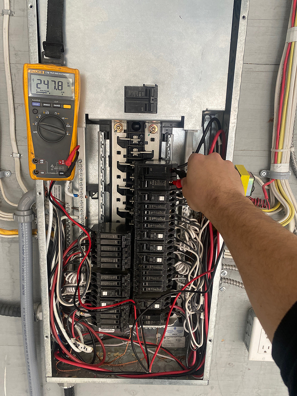 Close-up of an outdated electrical fuse box, a clear sign an electrical panel upgrade is needed.