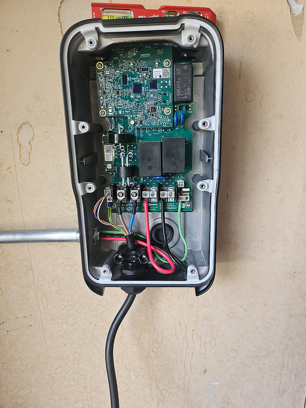 EV Charger Installation on exterior wall – Crew Electrical Services Calgary.