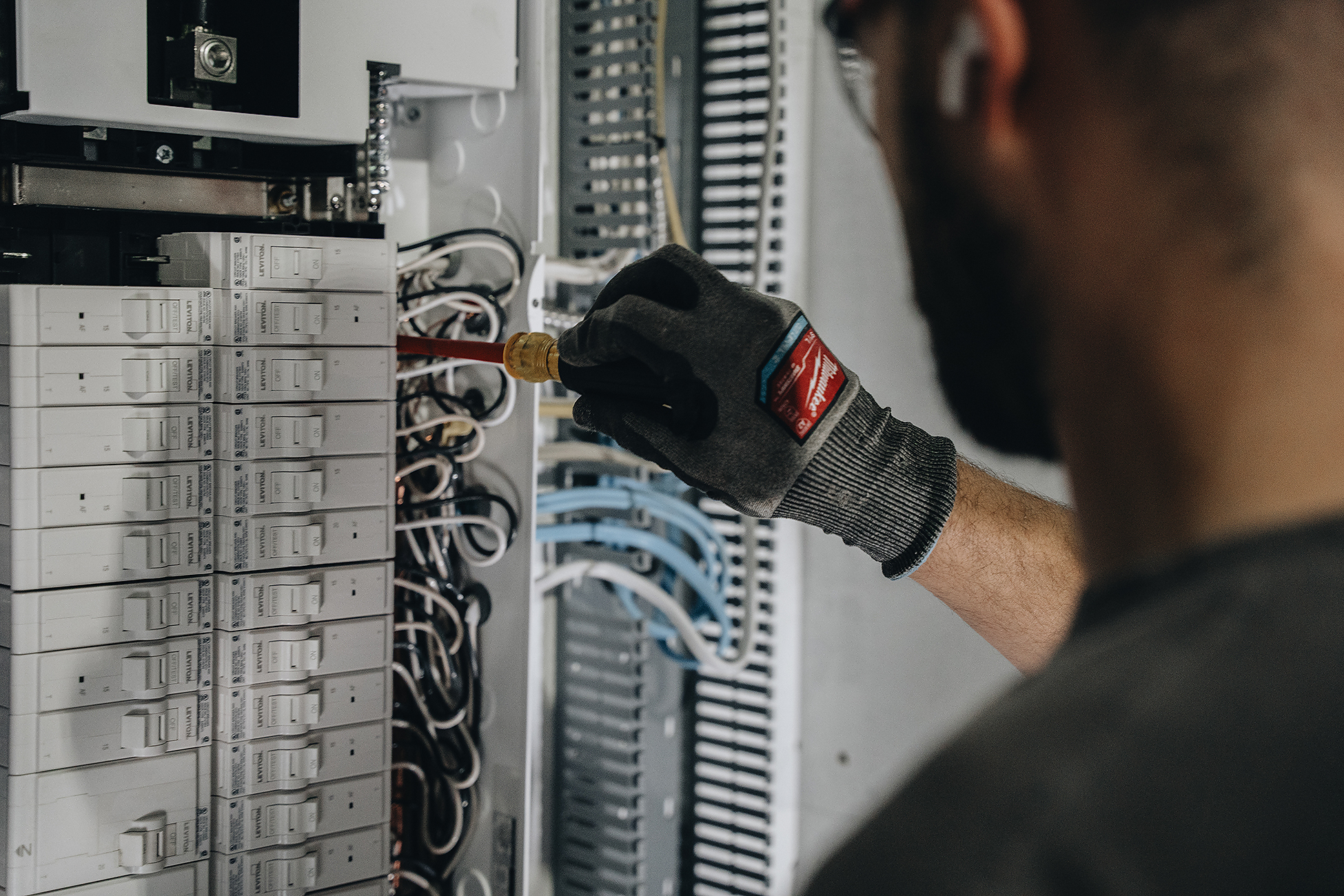 Crew Electrical Services preparing AC connections in Calgary—panel capacity check and breaker install