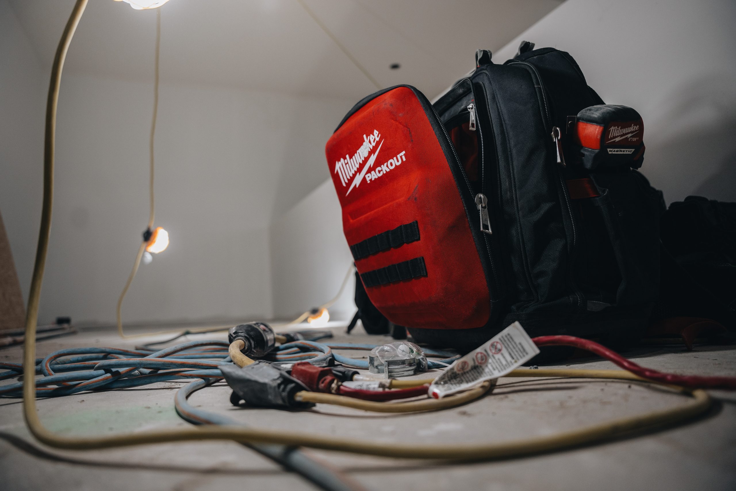 Crew Electrical Services electrician working in an Airdrie utility room