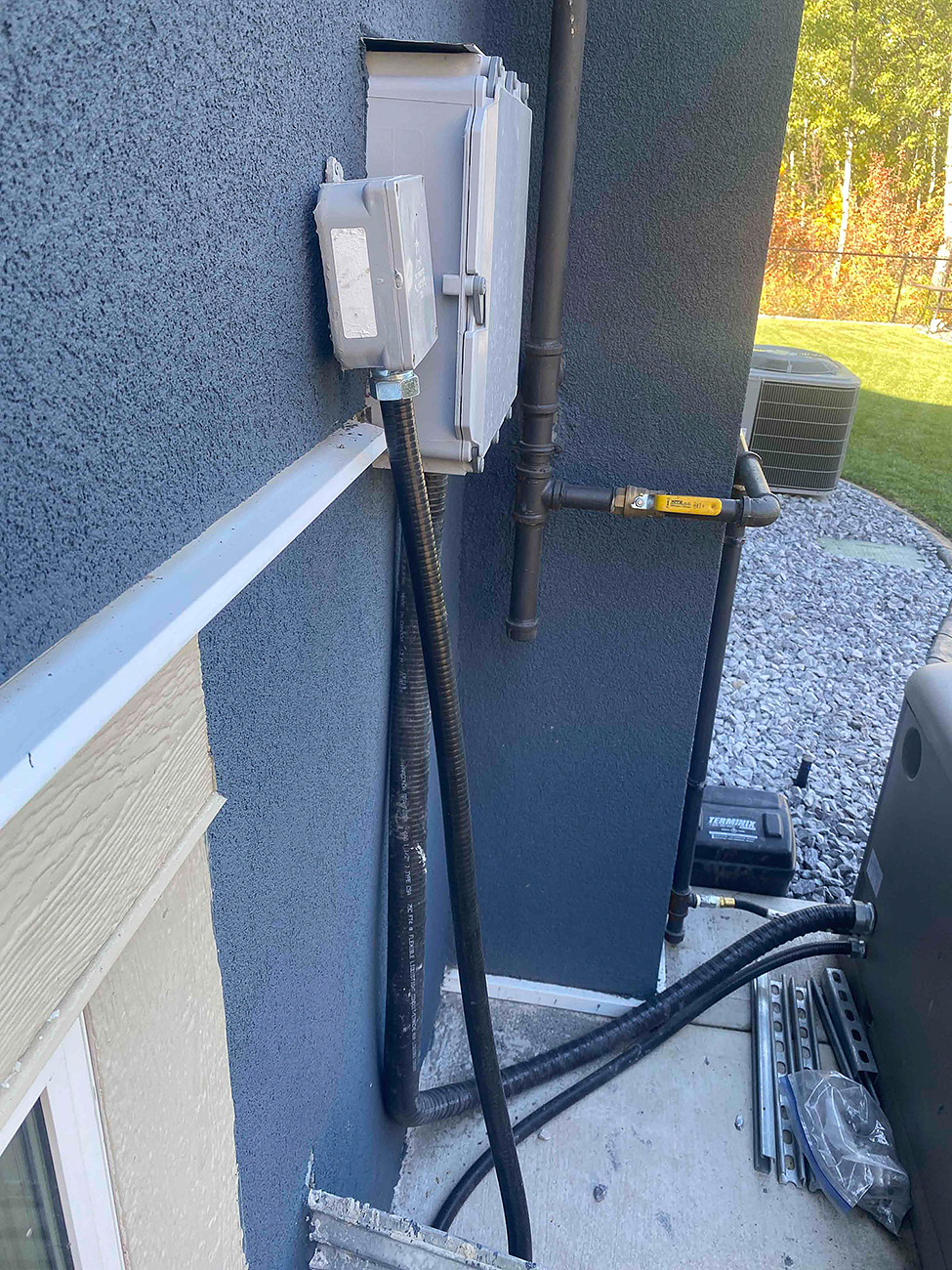 Hot tub connections by Crew Electrical Services showing outdoor spa with dedicated electrical disconnect