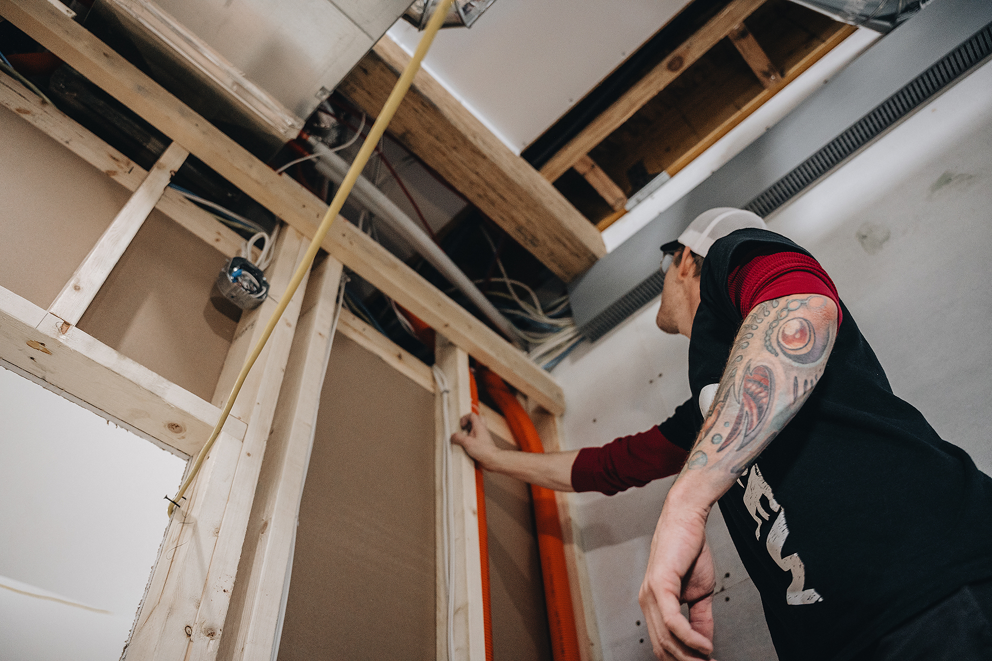 Basement electrician in Calgary — media wall power and low-voltage paths installed by Crew Electrical Services