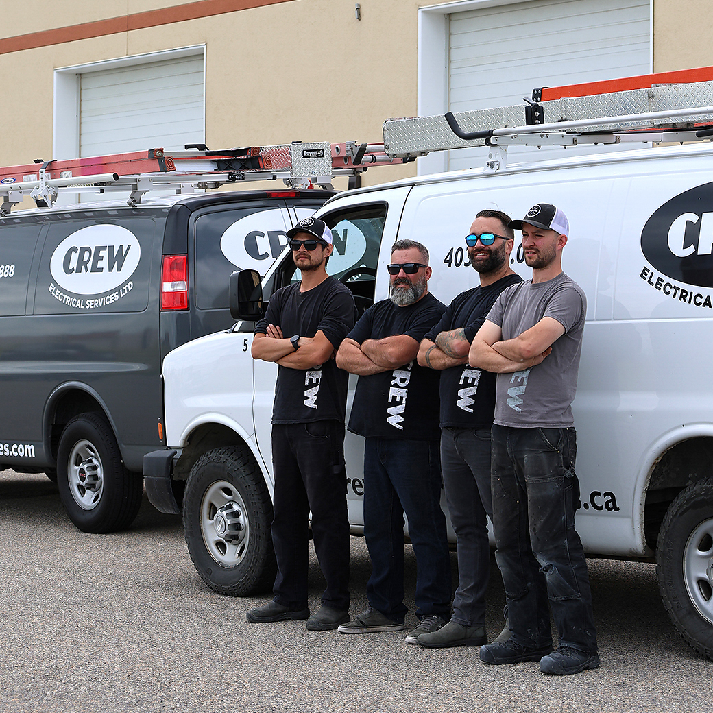 Crew Electrical Services team upgrading an electrical panel in a Springbank Hill home