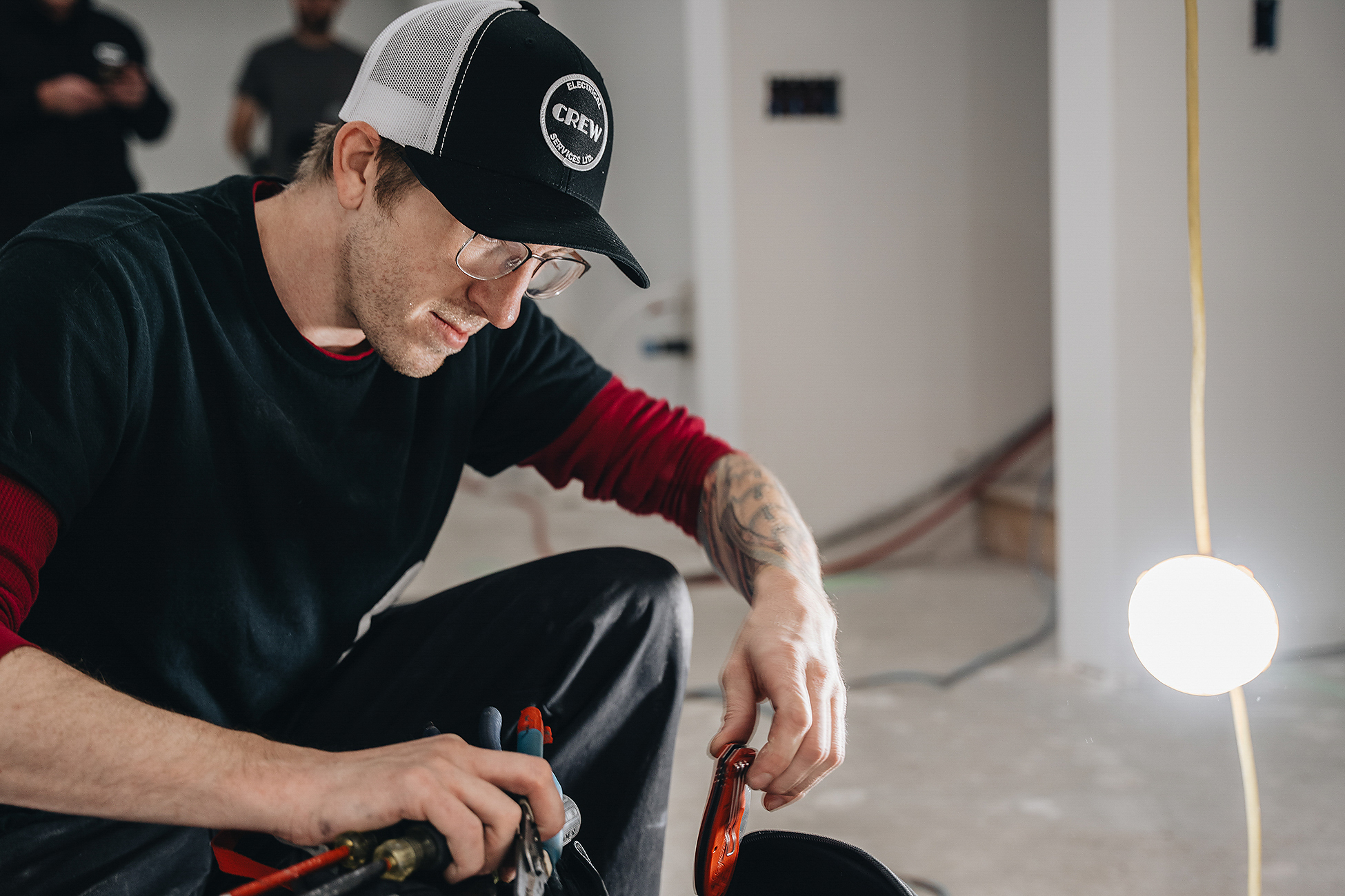Crew Electrical Services installing a Level-2 EV charger in a Heritage Pointe garage