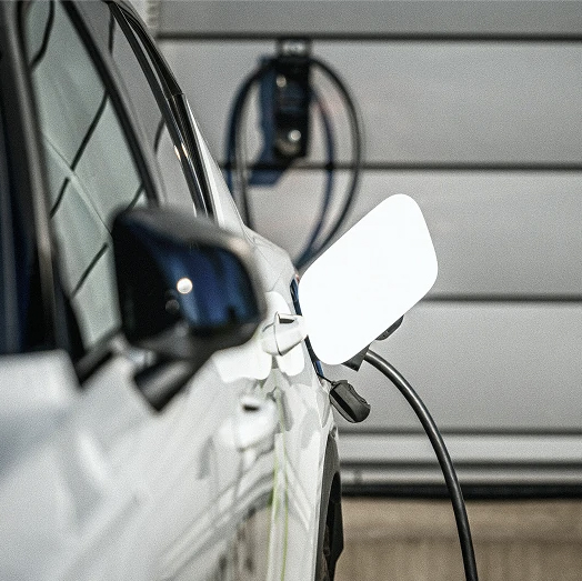 Crew Electrical Services electrician installing a home EV charger in a Calgary garage