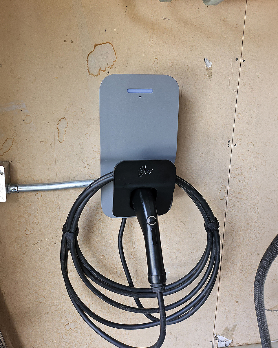 Wall-mounted Level 2 EV charger installed in a residential garage