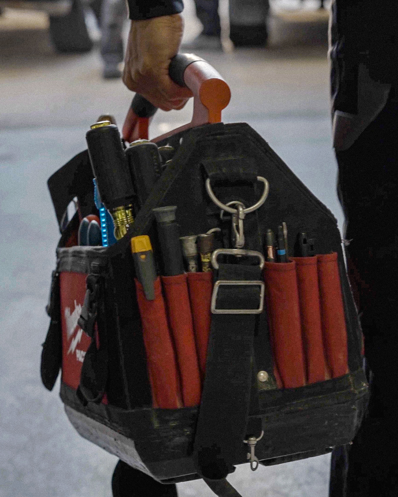 Electrician restoring damaged circuits during a disaster recovery project