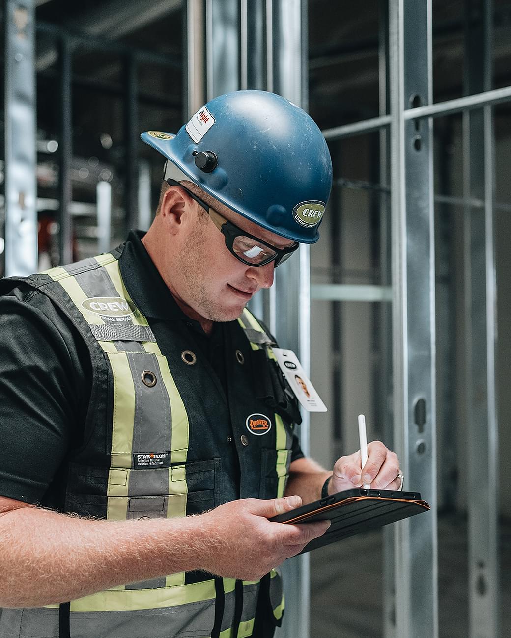 A licensed CREW Electrical electrician working on a commercial electrical project.